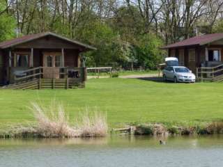 Cabins beside a fishing lake, Northamptonshire,  England